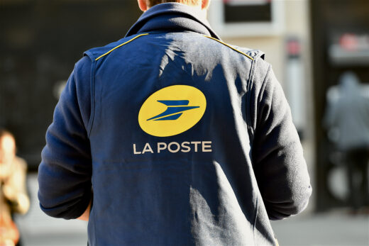 Paris,,france 01,11,2024:,postman,on,a,street,of,paris,