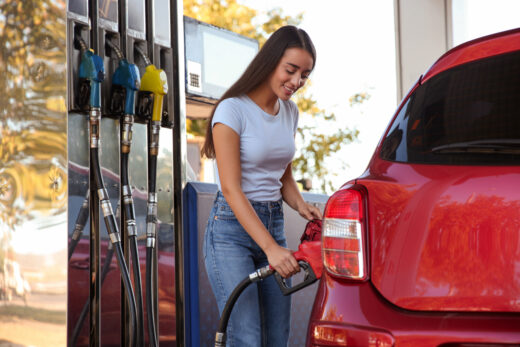 Young,woman,refueling,car,at,self,service,gas,station