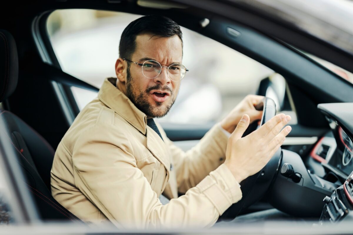 An,angry,driver,is,frowning,and,swearing,other,drivers,while