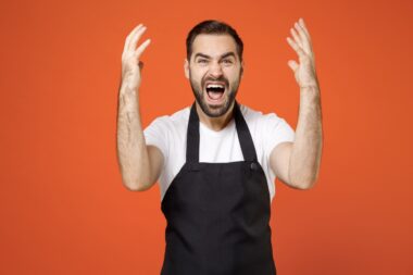 Young,indignant,angry,stressed,man,barista,bartender,barman,employee,in